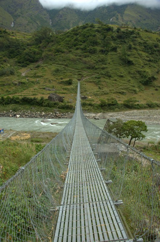 Probably the longest suspension bridge in Nepal with Phillim sitting above