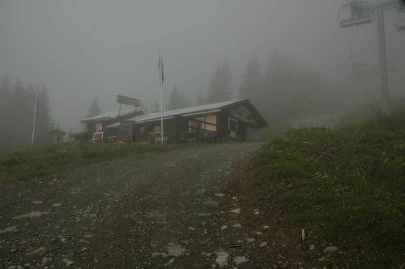 La Ferme Cafe Restaurant covered in fog on the way up to Col de Voza