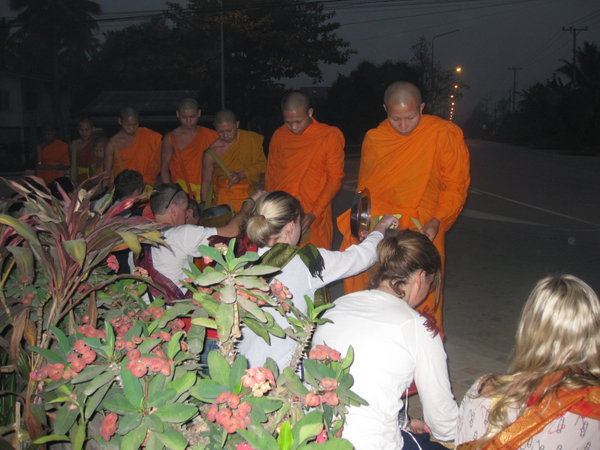 May giving alms to Monks