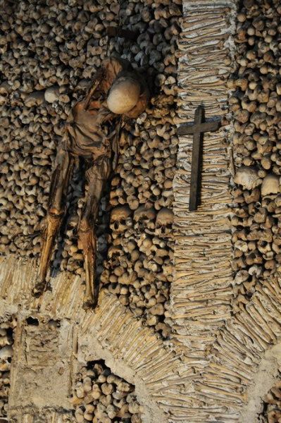 The hanging monk within the Church of Bone - Evora, Portugal