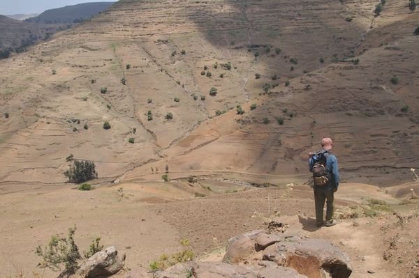 Desarie stands at the top of the valley - Simien Mountains, Ethiopia