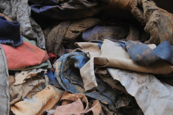 Discarded clothes within the Murambi Genocide Memorial, Rwanda