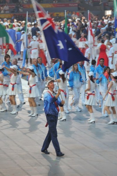 Six-time Olympian James Tomkins gazes proudly at the Australian flag