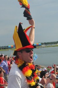 A German fan passionately supports his country's rowers
