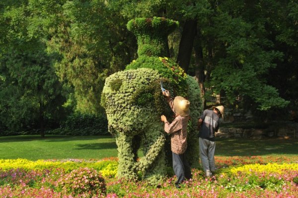 Gardeners trim an elephant - The Summer Palace, Beijing