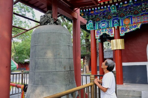 Admiring an ancient bell - Lamu Temple, Beijing, China