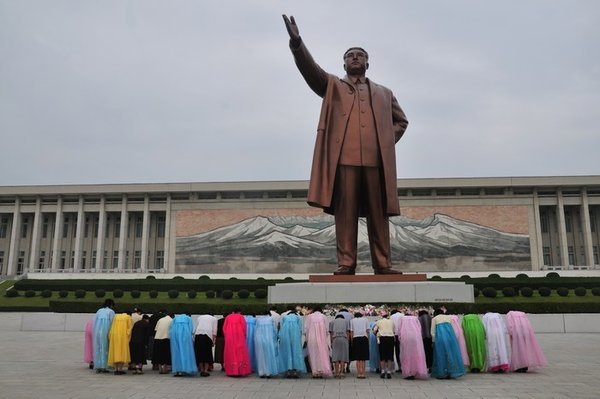Showing respect at the Statue of the Great Leader on Mansu Hill - Pyongyang, North Korea