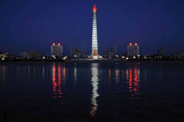 The Juche Tower is reflected in the Taedong River - Pyongyang, North Korea