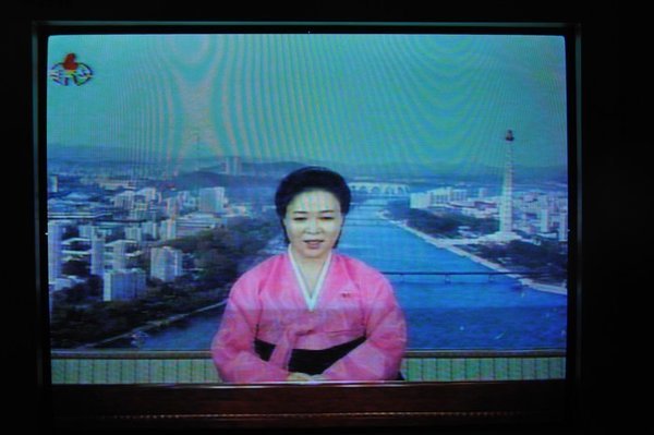 Newsreader on North Korean TV.