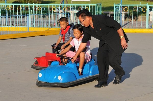 Families at play at the Mangyongdae Fun Fair - near Pyongyang, North Korea