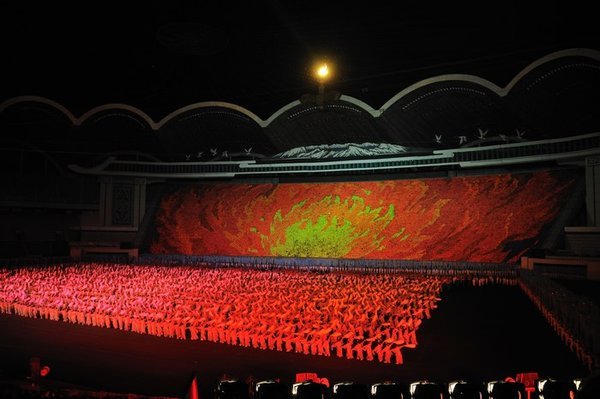 The cauldron is lit at the Arirang - Pyongyang, North Korea