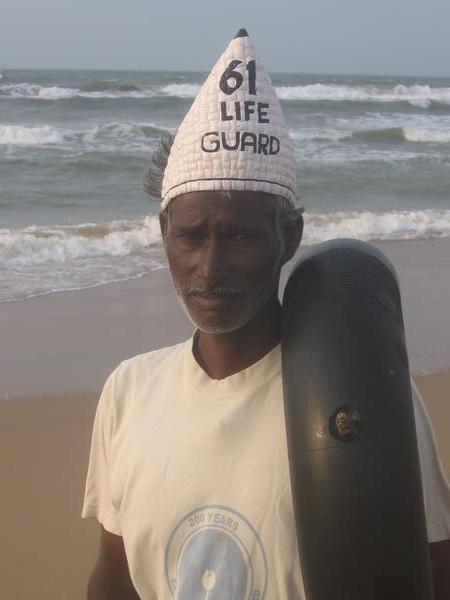 A Puri lifeguard wearing curious headwear