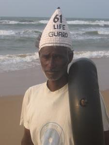 A Puri lifeguard wearing curious headwear
