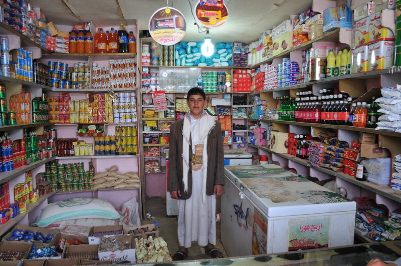 Proud shopkeeper - Shibam, Haraz Mountains, Yemen