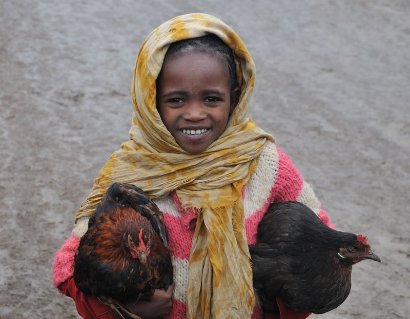 The chicken-holding girl who followed me around - Dorze, Ethiopia