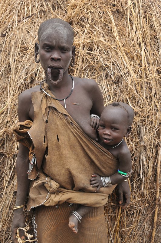 Mursi woman with streched lip - Mago National Park, Omo Valley, Ethiopia