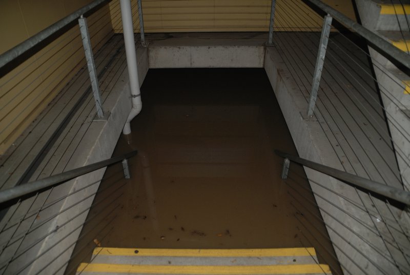 Steps to the lower level of the Southbank carpark only lead to water - 13 Jan - Brisbane, Australia