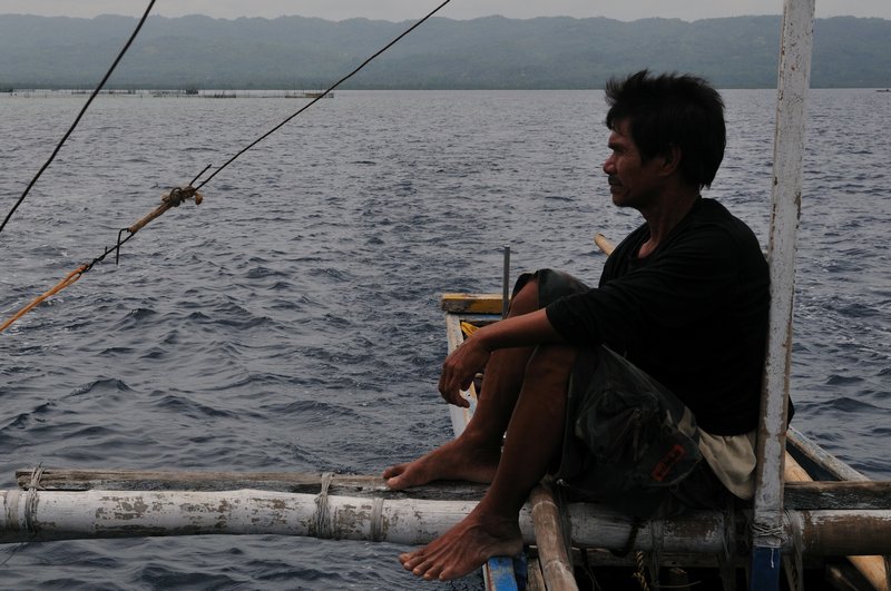 Bohol Safety Officer surveys the water from a boat - Philippines