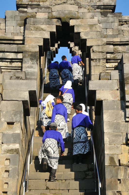 Students climb steep stairs - Borobudur, Java, Indonesia