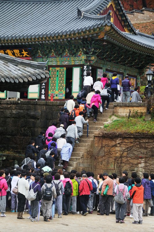 Visitors ascend stairs at the Haeinsa Temple - near Daegu, South Korea