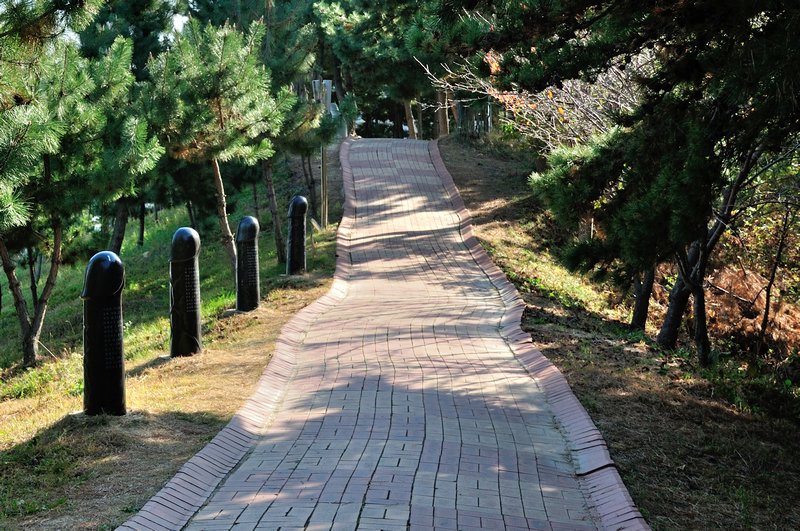 Pathway with ornaments on hill's ridge - Haesindang Park, Sinnam, South Korea
