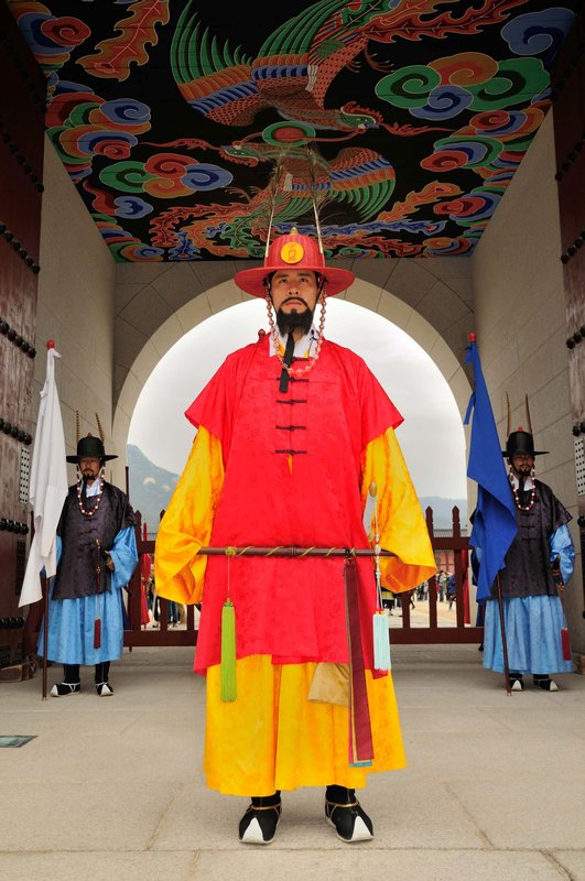 Guard in traditional attire at Gyeongbokgung Palace - Seoul, South Korea  