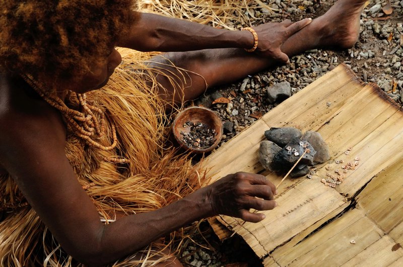 Heating the brown Kee shells turns them pink - Busu Island, Langa Langa Lagoon, Malaita, Solomon Islands