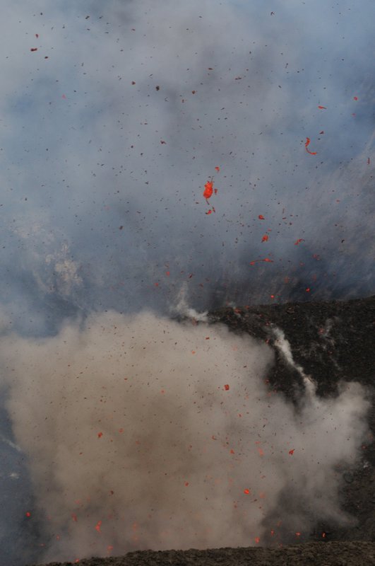Large pieces of lava are catapulted into the sky - Mount Yasur, Tanna Island, Vanuatu