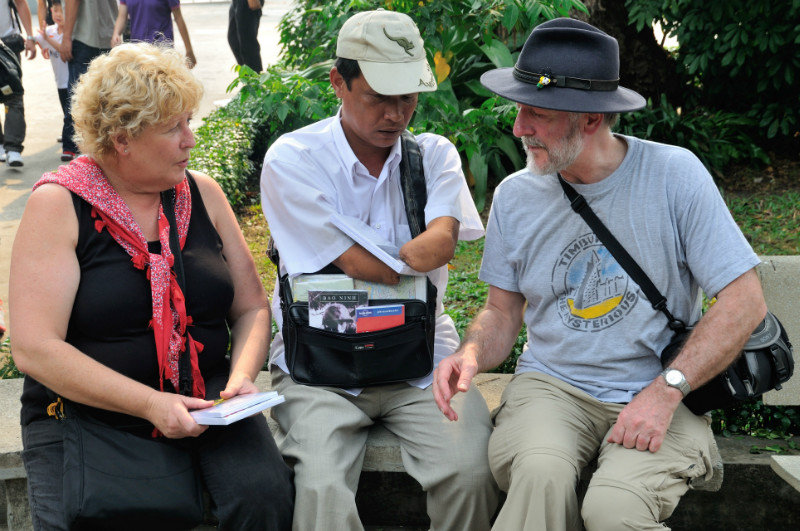 Denise and Dave speak to a landmine victim - War Remnants Museum, Ho Chi Minh City, Vietnam