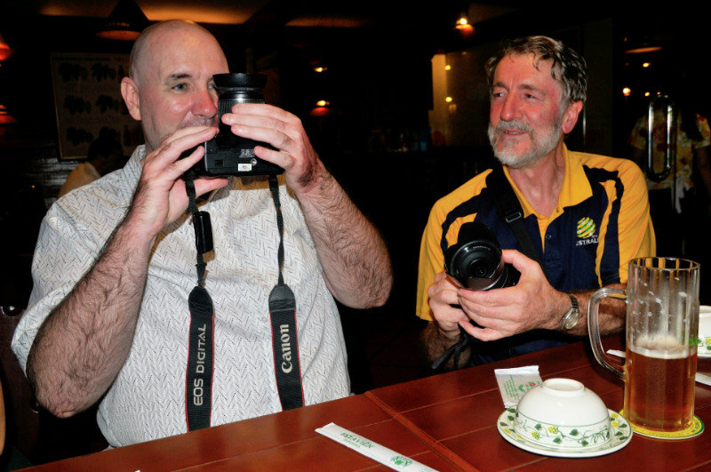 Cockle and Dancing Dave comparing the size of their lenses - Ho Chi Minh City, Vietnam