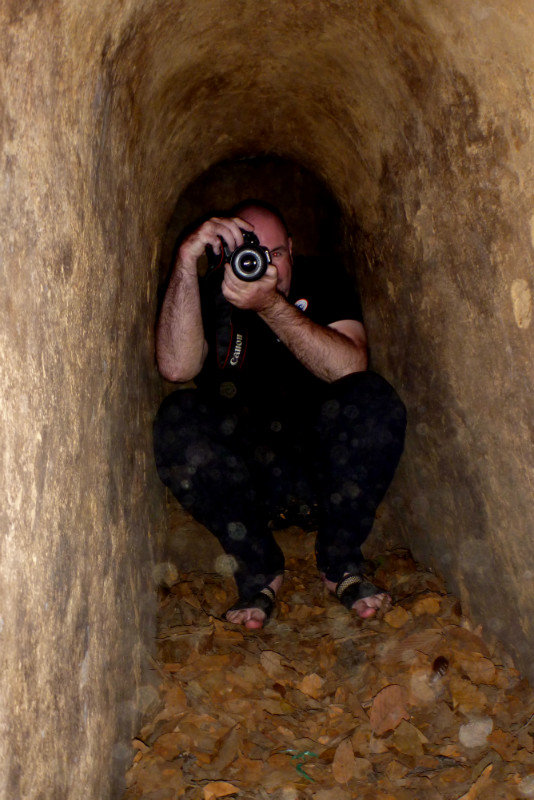 Nick photographs me within the cramped Cu Chi tunnels, Vietnam