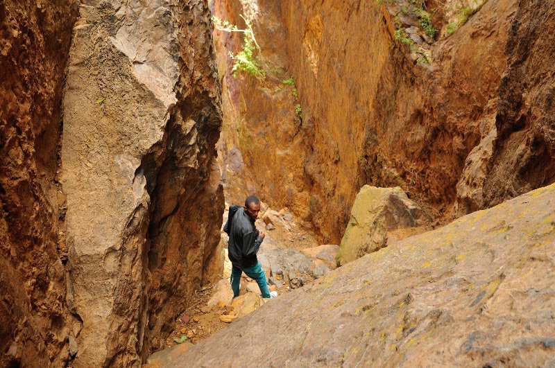 Mulugeta waits for my descent during hike from Abuna Gebre Mikael - Tigray Region, Ethiopia