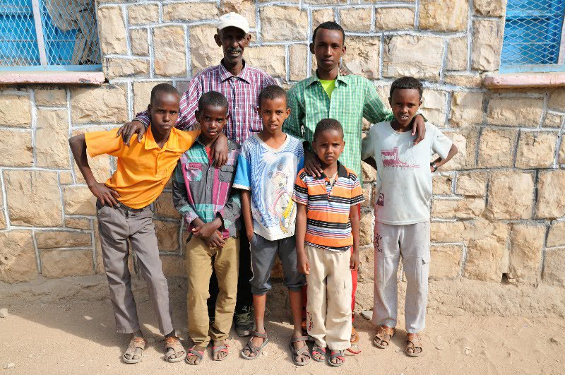 Abdullah with children - Hargeisa animal market, Somaliland
