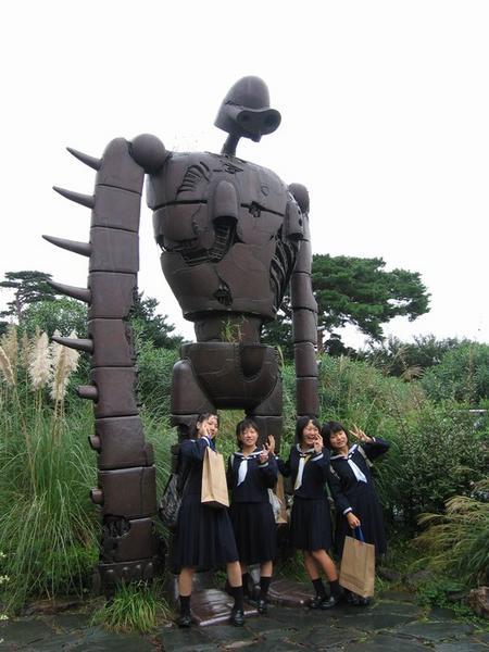 Excited schoolgirls posing in front of a Miyazaki creation - Ghibli Museum, Mitaka