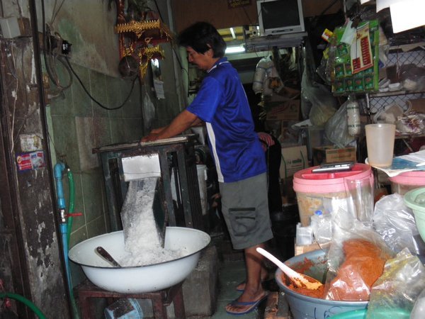grinding coconut making milk