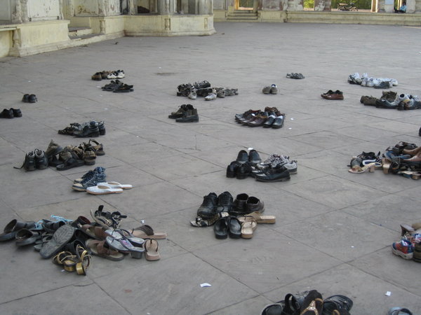 Taking shoes off before entering Mosque