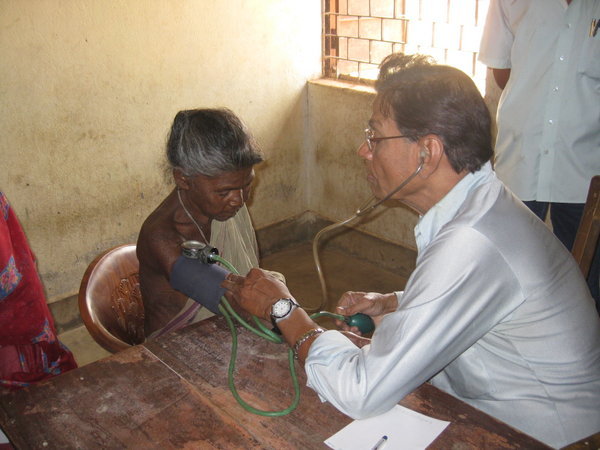 Dr. taking blood pressure