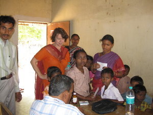 Margaret with kids getting health care at clinic