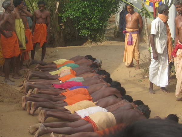 Prostrate Men ready for rituals to begin