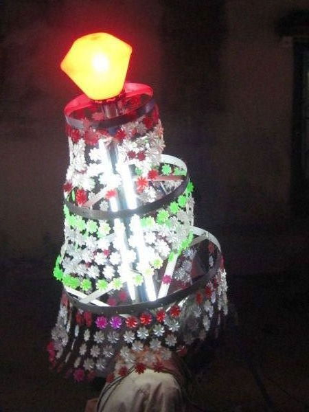 Lighted lanterns are worn on head in procession