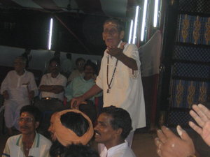 An elder leads an Indian Folk Song