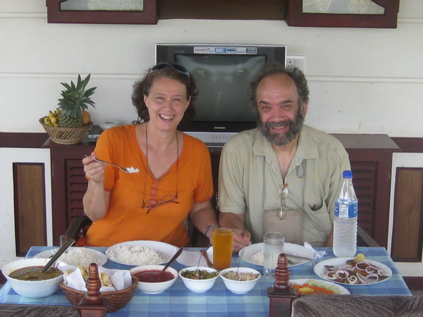 Stan & Margaret eating a feast cooked on houseboat