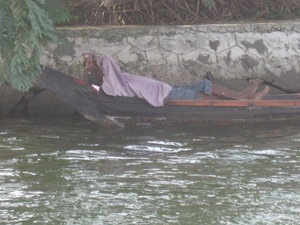 Man taking a siesta in his boat