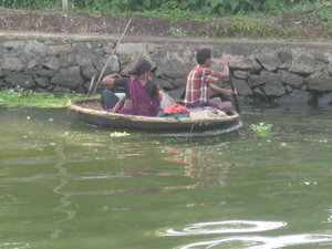 Family in round boat crossing the water