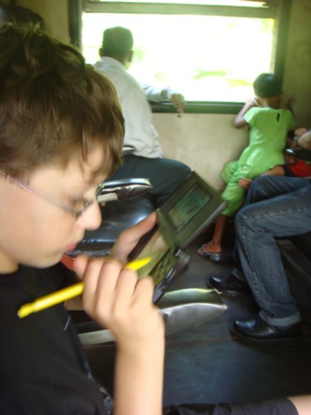 Jake enjoys his DS on the train!