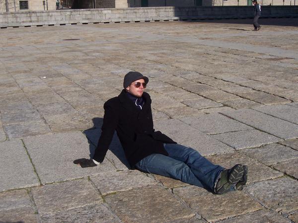 Greg... sitting in the sun... in the plaza...