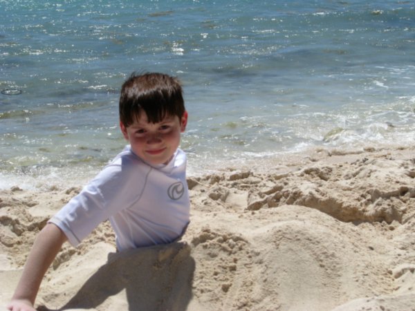 Aidan buried in the sand