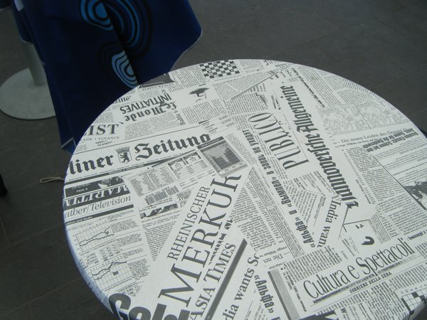 A strangely designed table covered with bulgarian papers