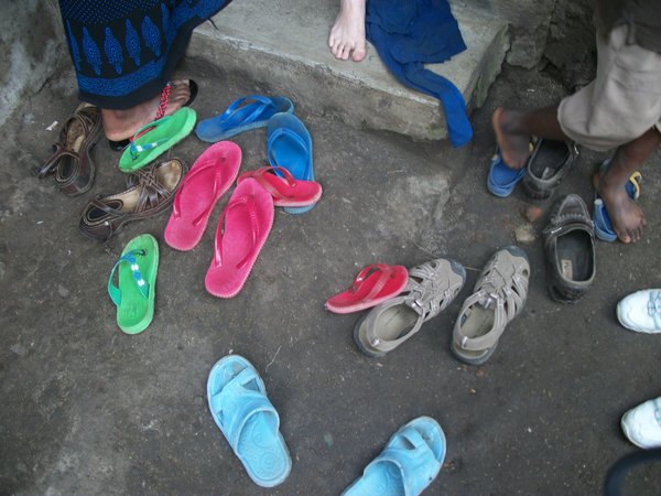 Taking off our shoes before going inside