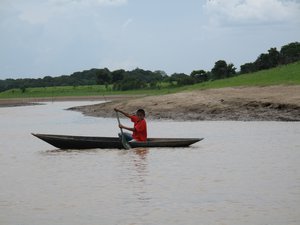 Young boy on pirogue